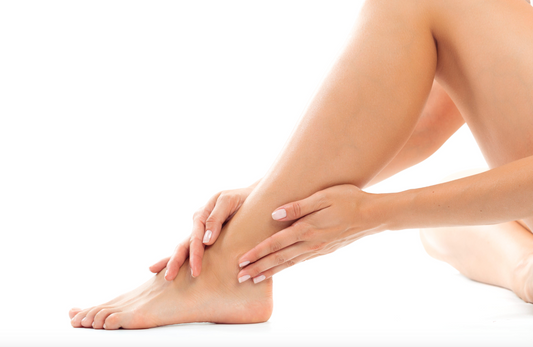 hands on a leg showing itchy skin