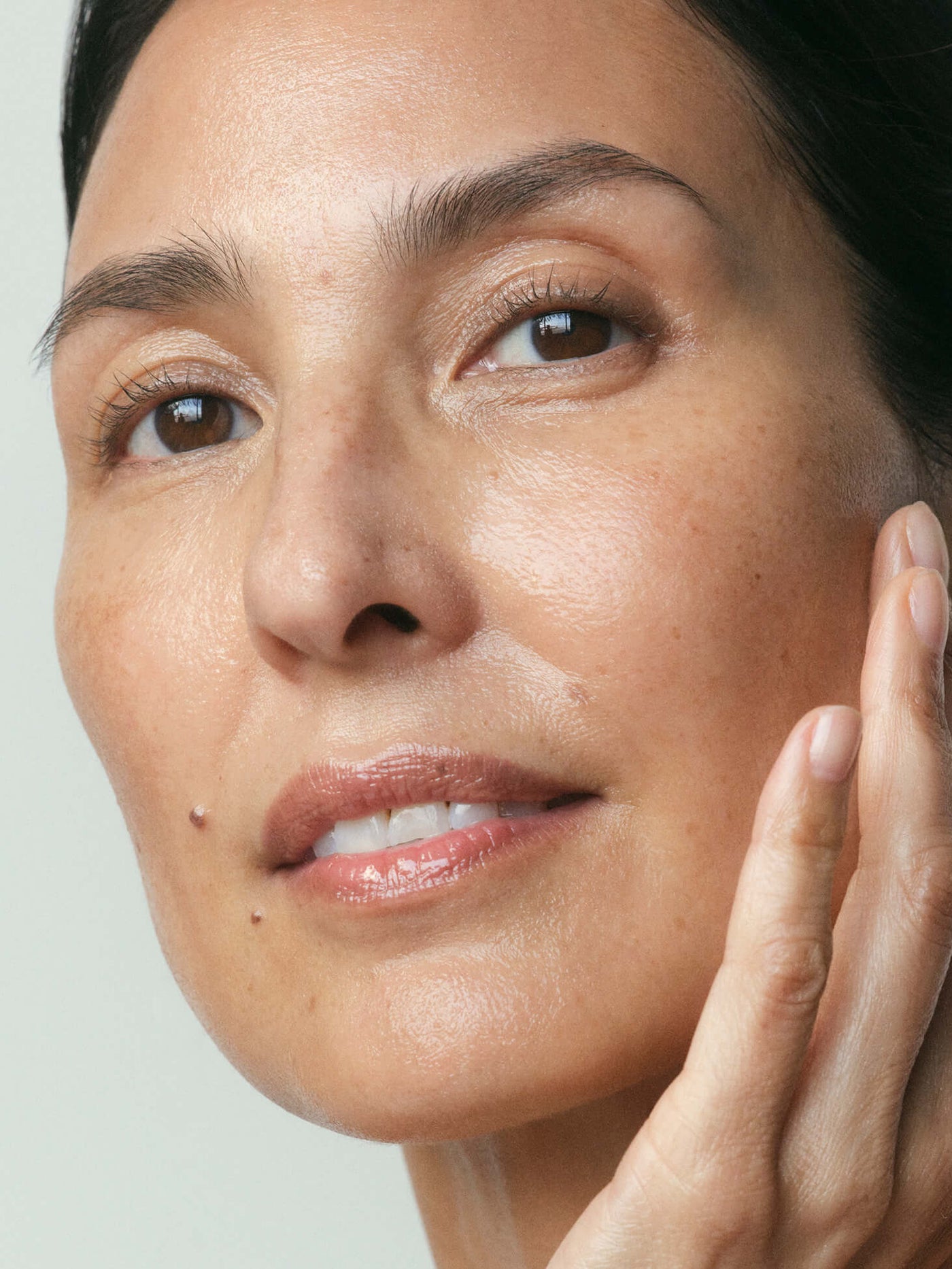 Phosis model with healthy, radiant midlife skin